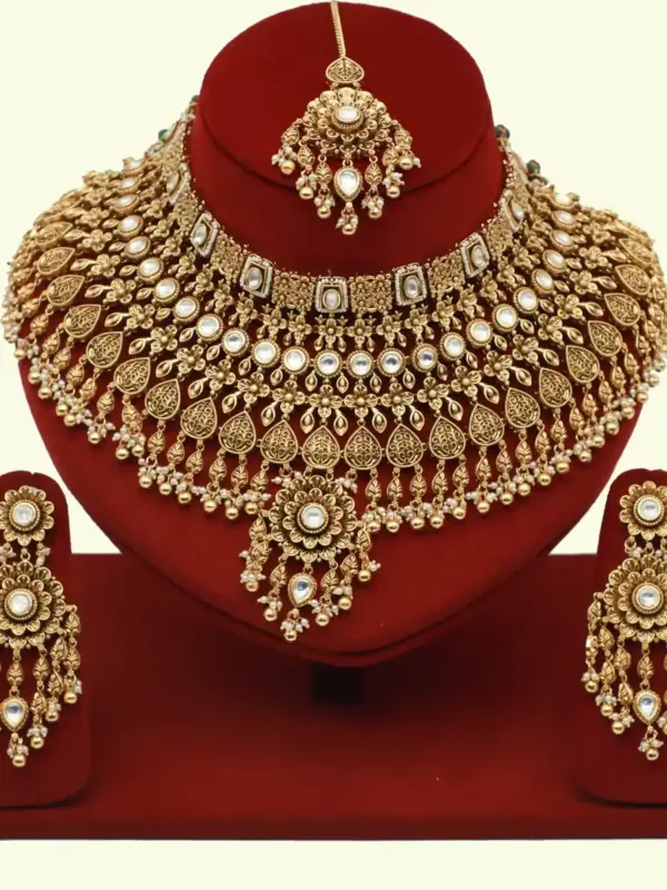 Heavy bridal brass choker necklace set with earrings and maang tikka in antique gold finish, Ishwar Arts and Crafts