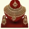 Heavy bridal brass choker necklace set with earrings and maang tikka in antique gold finish, Ishwar Arts and Crafts